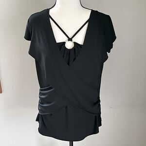 Discreet Black Top. Fits Like a Medium to Large.